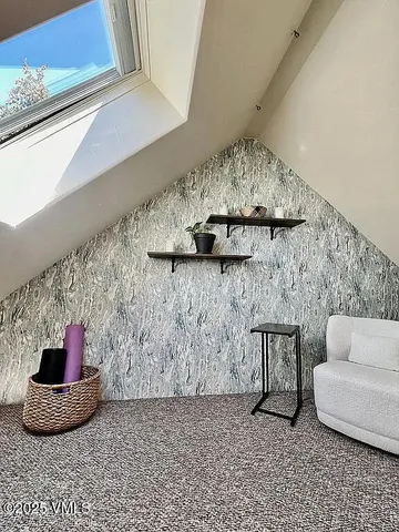 a room with a table and a fireplace