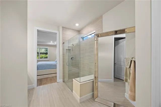 a bathroom with a shower and a sink