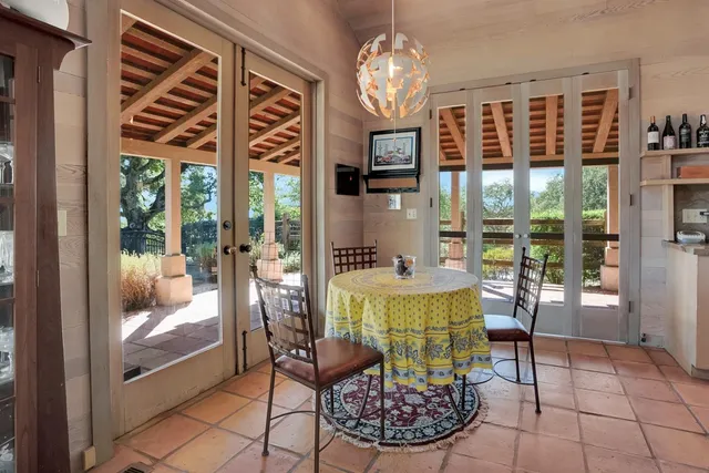 a view of a dining room with furniture wooden floor and chandelier