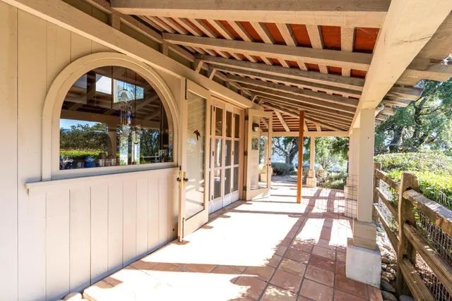 a view of a porch with wooden floor and outer view