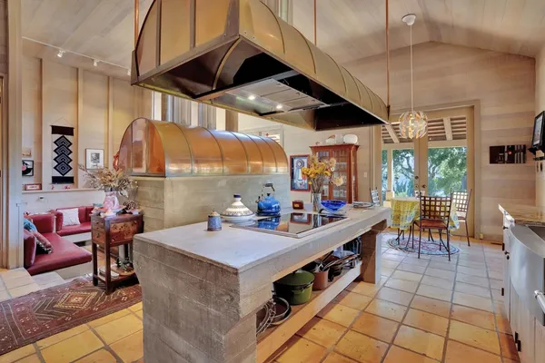a kitchen that has a lot of cabinets in it