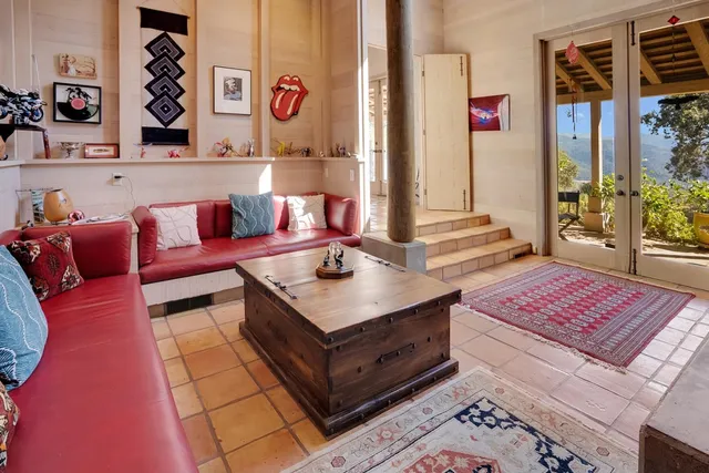 a living room with furniture and a rug