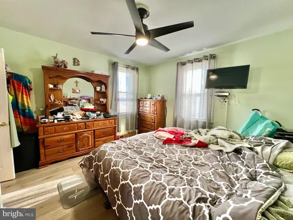 a bed room with bed and a television