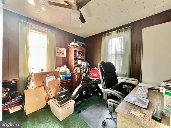 a room with workspace and windows