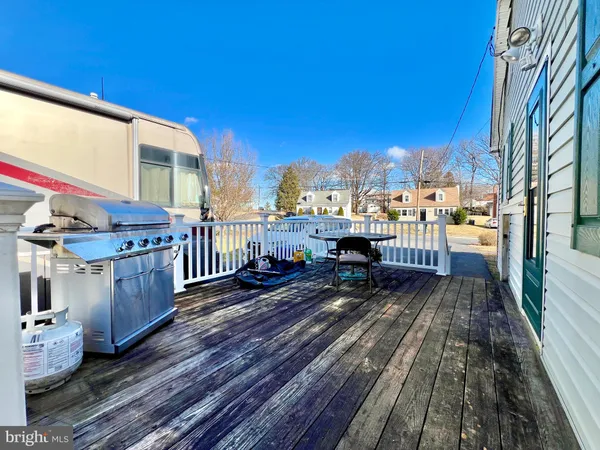a view of a balcony with wooden floor