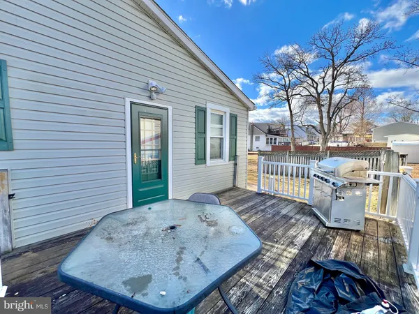 a view of a patio with wooden floor