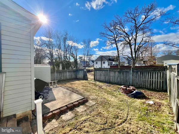 a view of backyard with a patio