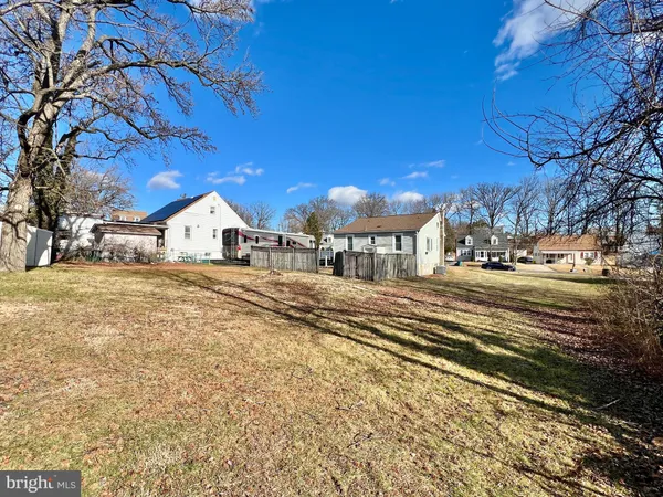 a view of city street with lots of trees