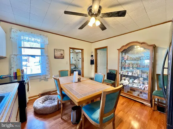 a dining room with furniture and window