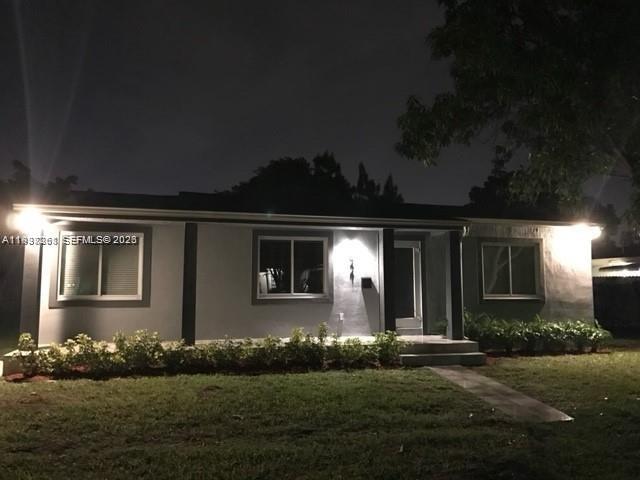 6441 Southwest 30th Street Miami, FL 33155 - Photo 2 of 13 a front view of house and yard with green space