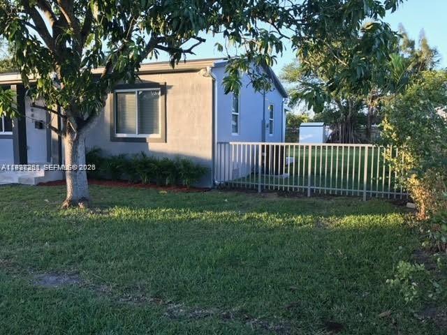 6441 Southwest 30th Street Miami, FL 33155 - Photo 3 of 13 a view of a house with a yard