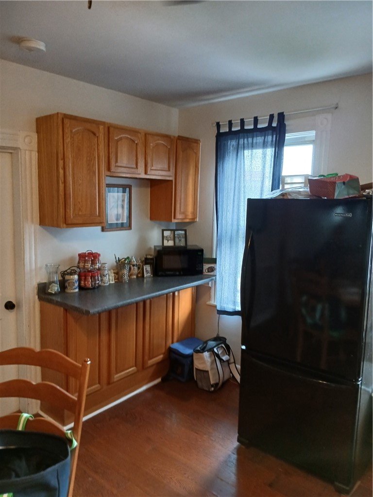 736 Social Street Woonsocket, RI 02895 - Photo 7 of 17 Refrigerator & additional cabinets