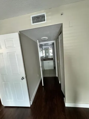 wooden floor in a hall with an entryway