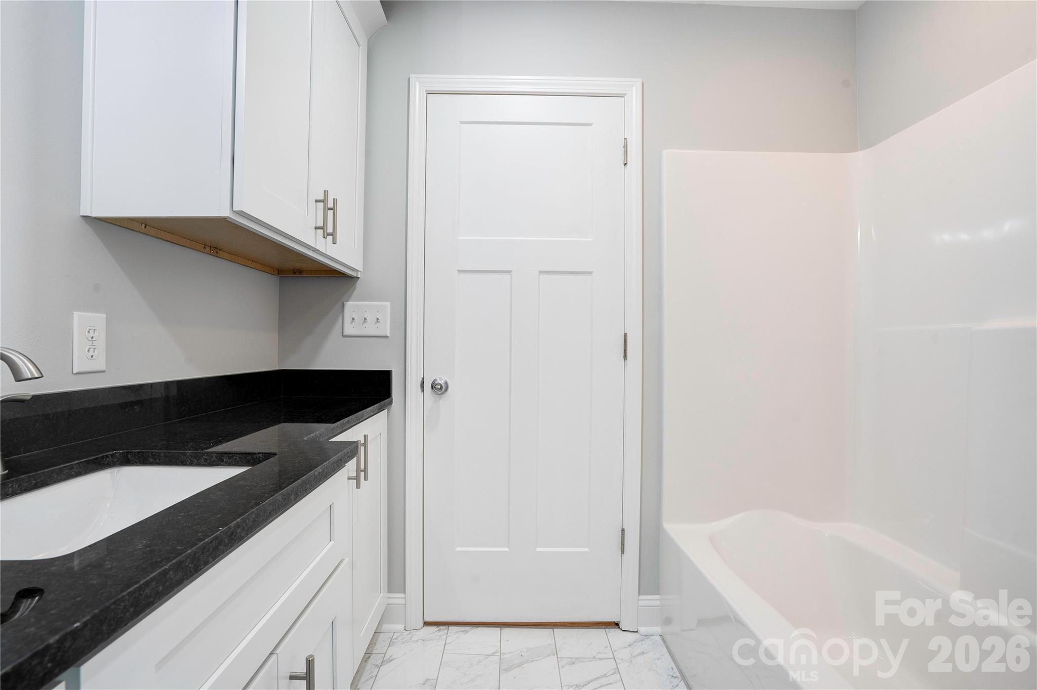 2822 Bettis Road Grover, NC 28073 - Photo 20 of 32 a kitchen with a sink and a refrigerator