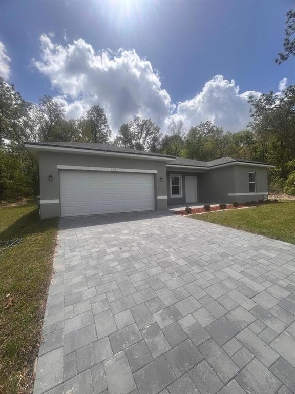 9451 North Emellia Avenue Citrus Springs, FL 34433 - Photo 1 of 24 view of house with yard and entertaining space
