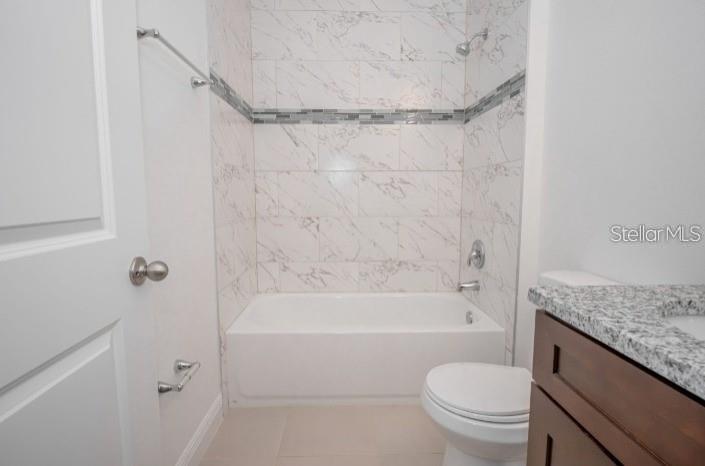 9451 North Emellia Avenue Citrus Springs, FL 34433 - Photo 18 of 24 a bathroom with a granite countertop bathtub shower sink vanity and toilet