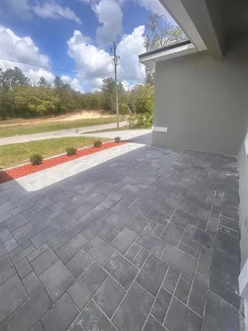 a view of an empty room with a ocean view