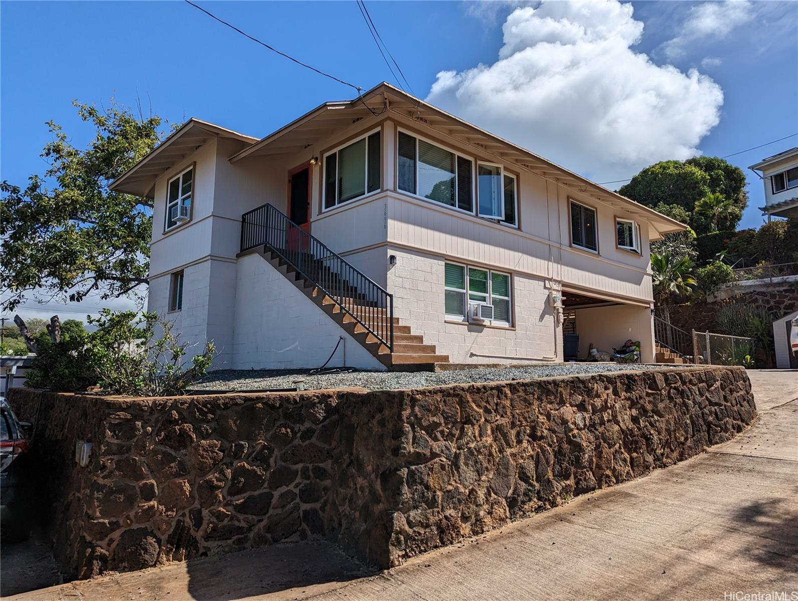 House is located above the road for privacy