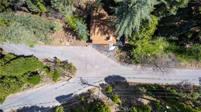 a view of a street with a yard