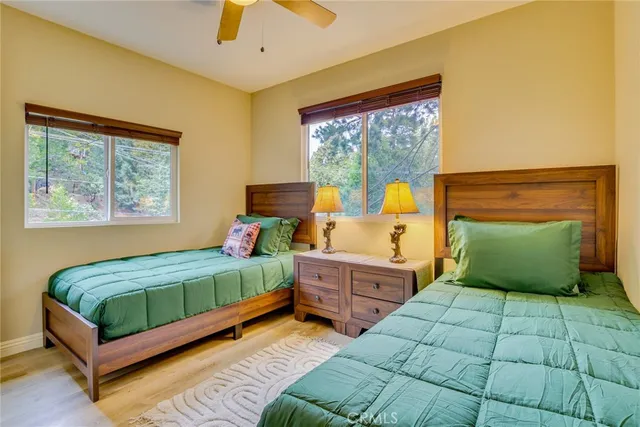 a bedroom with a large bed and a window