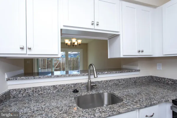 a kitchen with a sink and a cabinets