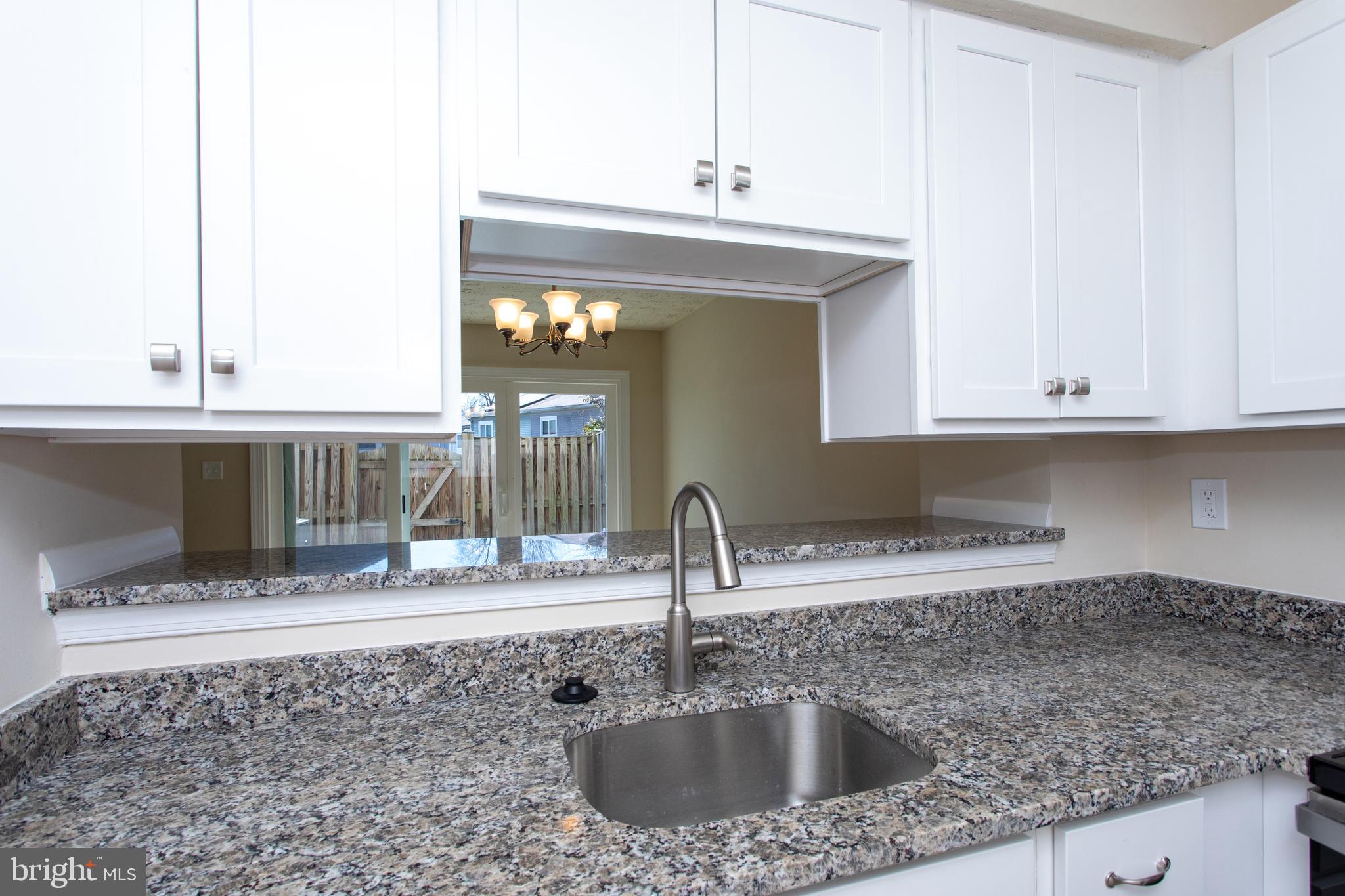 3147 Heath Cote Road Waldorf, MD 20602 - Photo 8 of 33 a kitchen with a sink and a cabinets