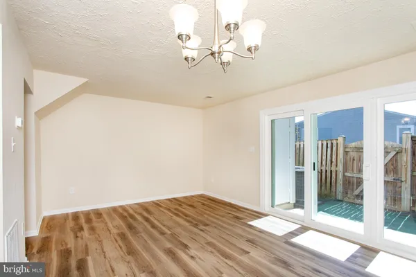 a view of kitchen with wooden floor