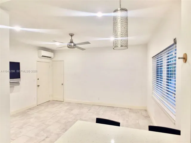 a view of a hallway with a chandelier