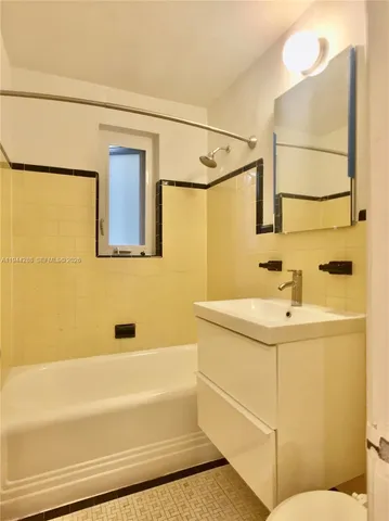 a bathroom with a sink and a bathtub