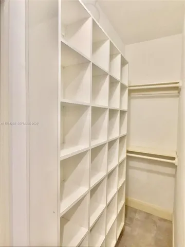 a view of an empty walk in closet