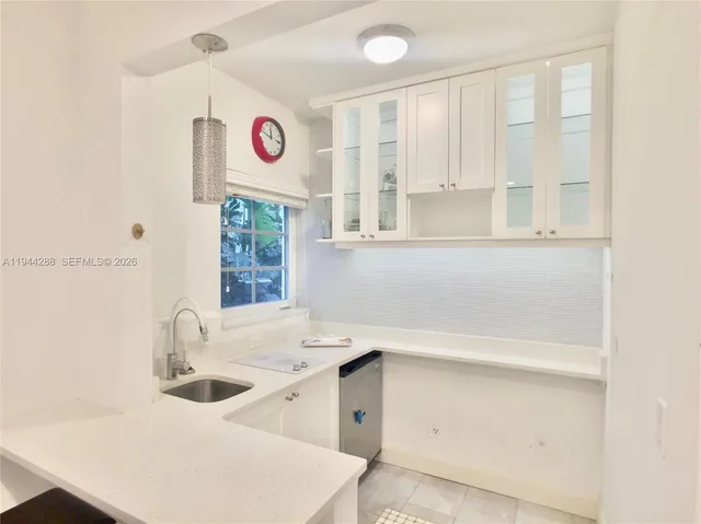 a bathroom with a sink and a window