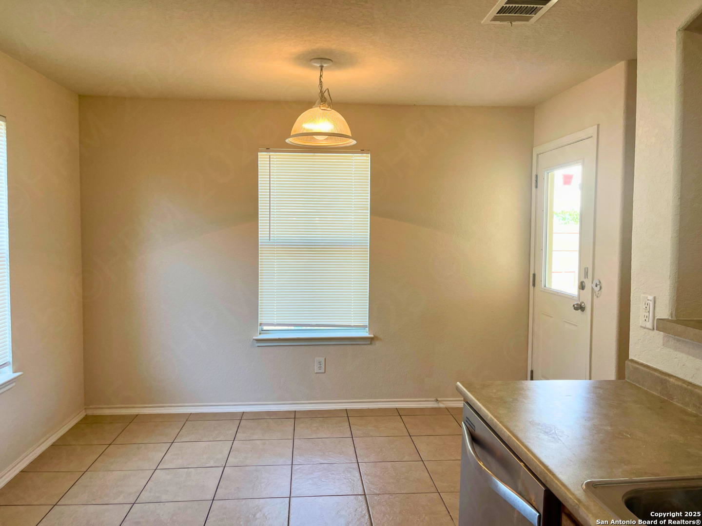 11027 Chicory Field Helotes, TX 78023 - Photo 11 of 22 an empty room with a window