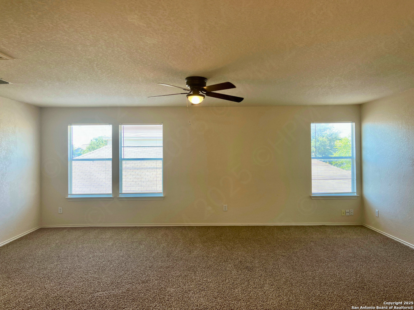 11027 Chicory Field Helotes, TX 78023 - Photo 12 of 22 an empty room with a window