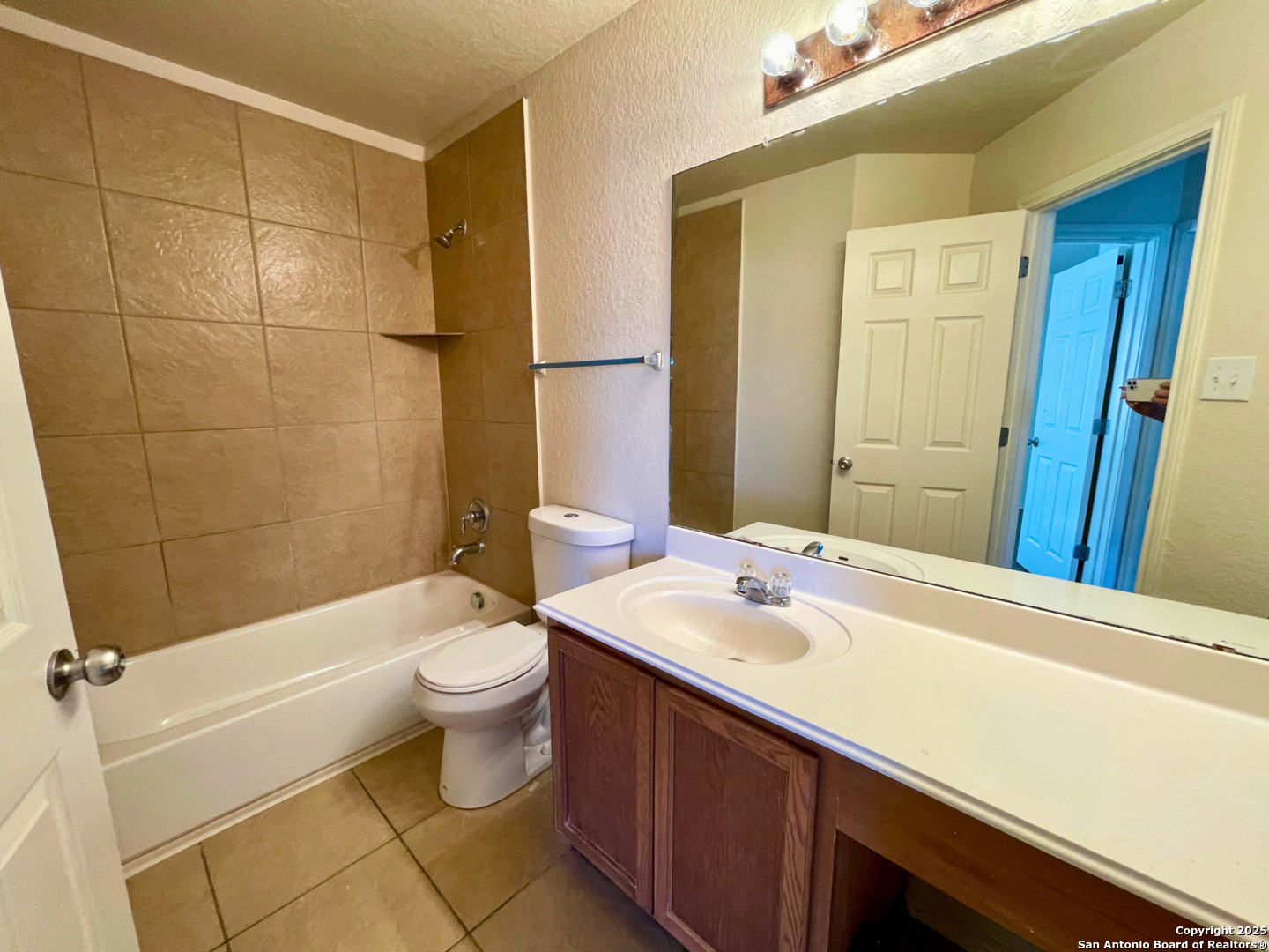 11027 Chicory Field Helotes, TX 78023 - Photo 17 of 22 a bathroom with a sink a toilet and shower