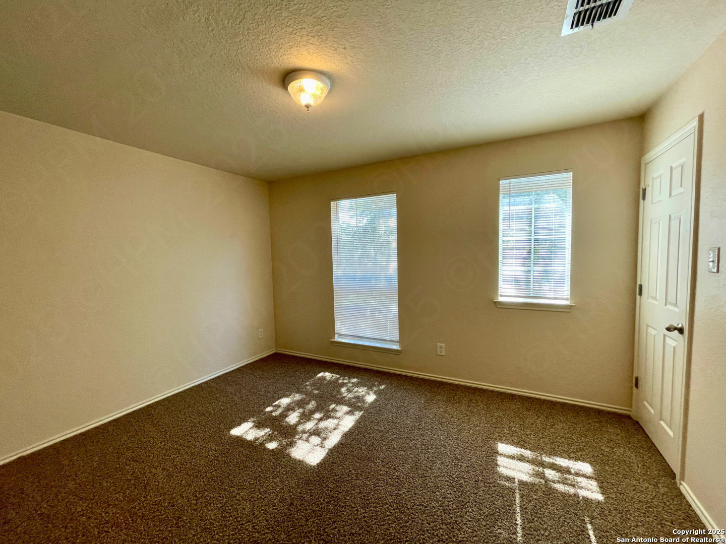 11027 Chicory Field Helotes, TX 78023 - Photo 18 of 22 a view of room with window and ample daylight