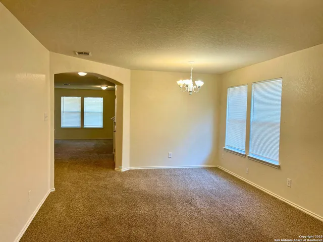 an empty room with a bathroom