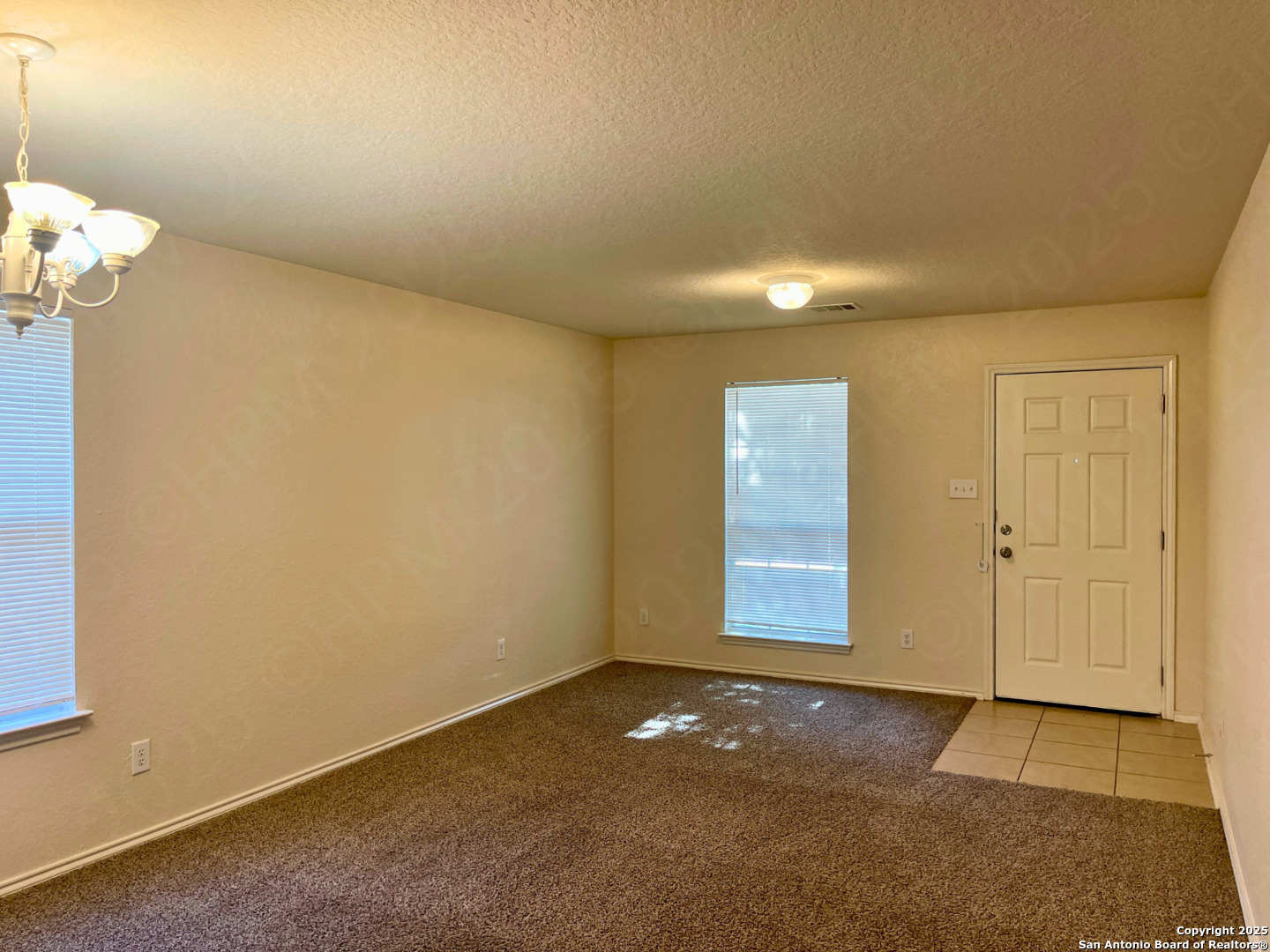 11027 Chicory Field Helotes, TX 78023 - Photo 6 of 22 an empty room with windows