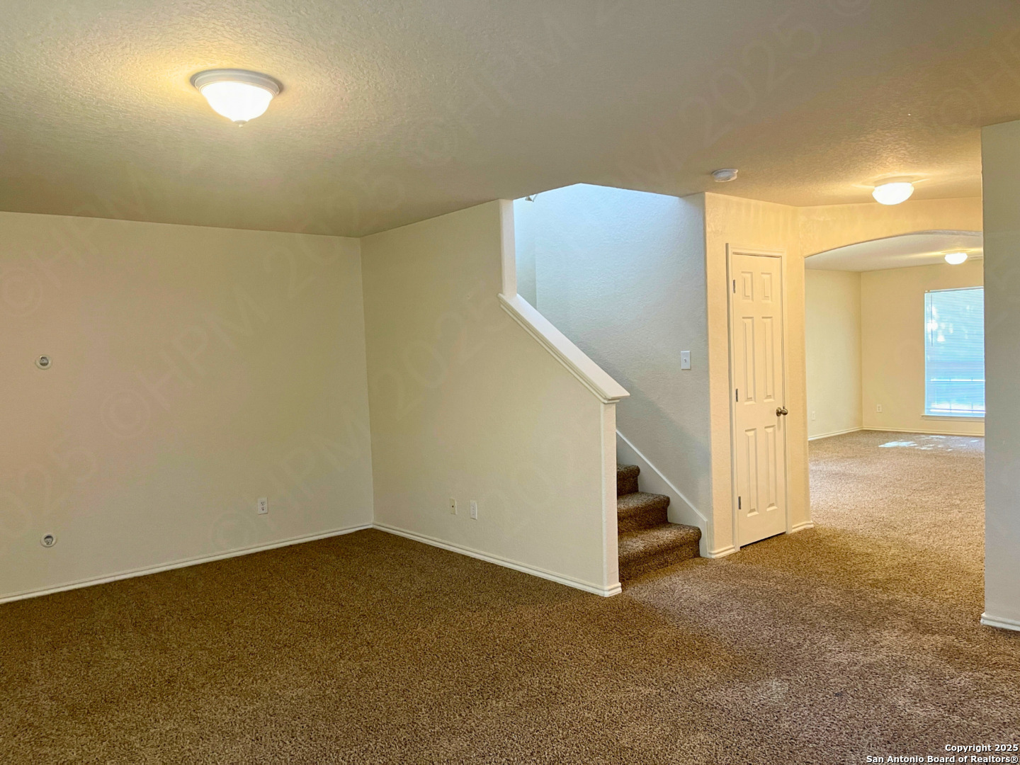 11027 Chicory Field Helotes, TX 78023 - Photo 9 of 22 a view of an empty room with stairs