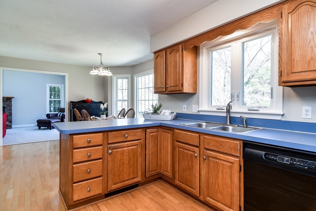16 Russet Hill Road Ashland, MA 01721 - Photo 12 of 30 a kitchen with wooden cabinets and a sink