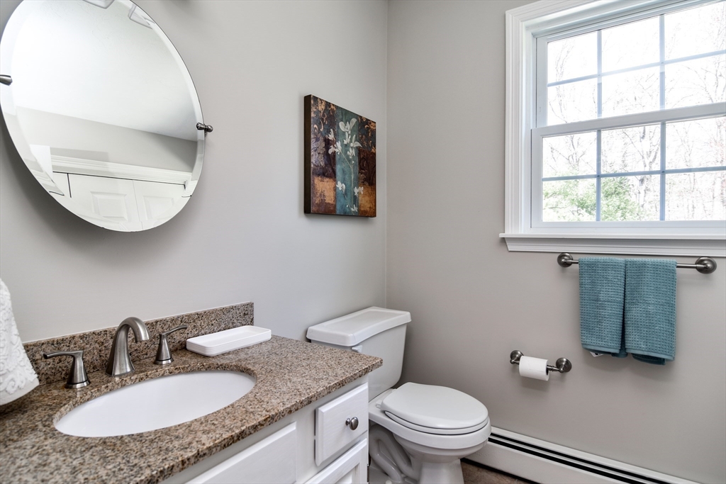 16 Russet Hill Road Ashland, MA 01721 - Photo 13 of 30 a bathroom with a granite countertop sink mirror and toilet