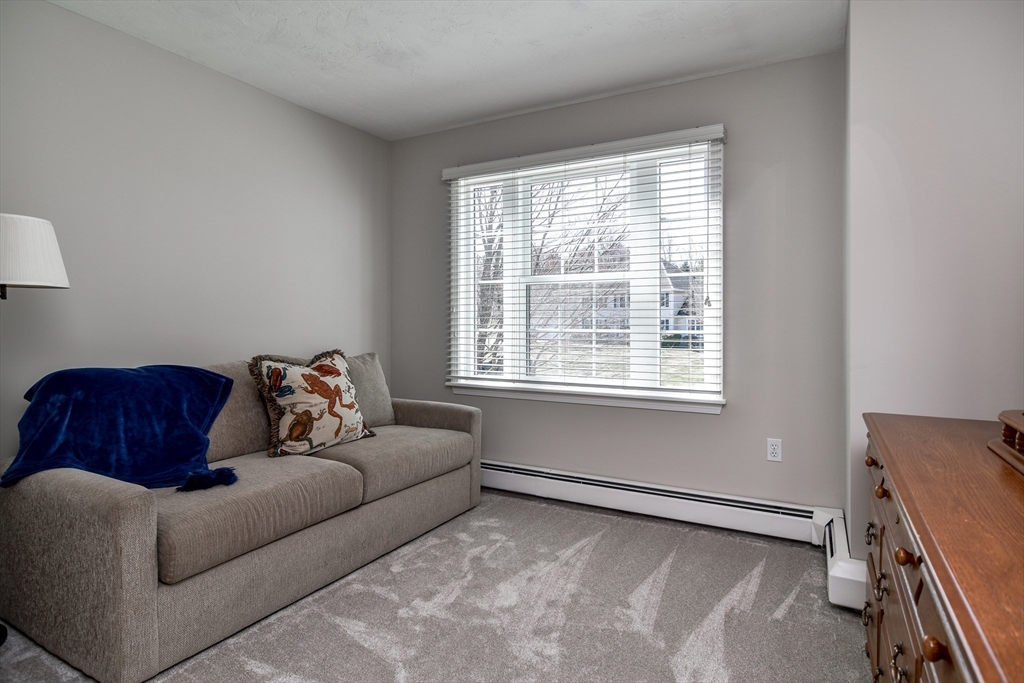 16 Russet Hill Road Ashland, MA 01721 - Photo 14 of 30 a living room with furniture and a window