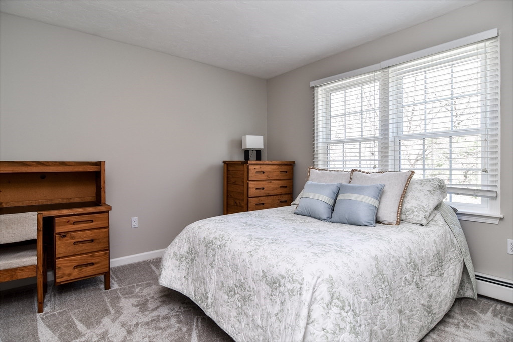 16 Russet Hill Road Ashland, MA 01721 - Photo 16 of 30 a bedroom with a bed and a dresser
