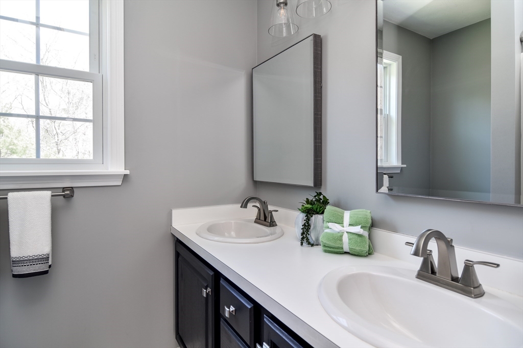 16 Russet Hill Road Ashland, MA 01721 - Photo 20 of 30 a bathroom with a sink and a mirror