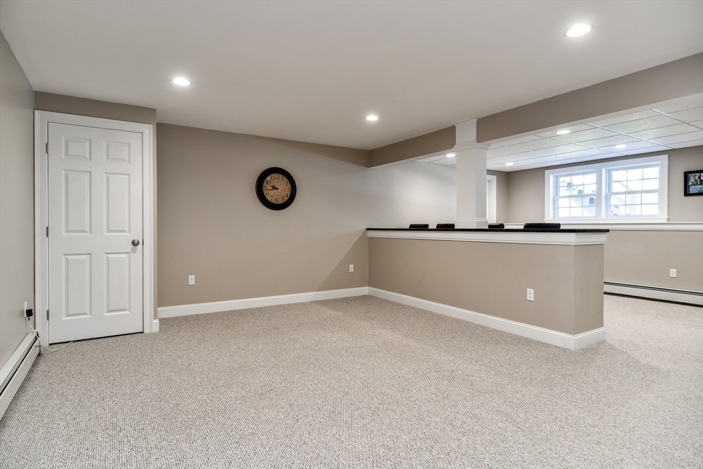 16 Russet Hill Road Ashland, MA 01721 - Photo 21 of 30 a view of a kitchen with a fridge and wooden floor