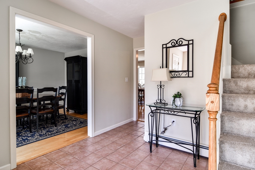 16 Russet Hill Road Ashland, MA 01721 - Photo 3 of 30 a view of hall way with furniture and mirror