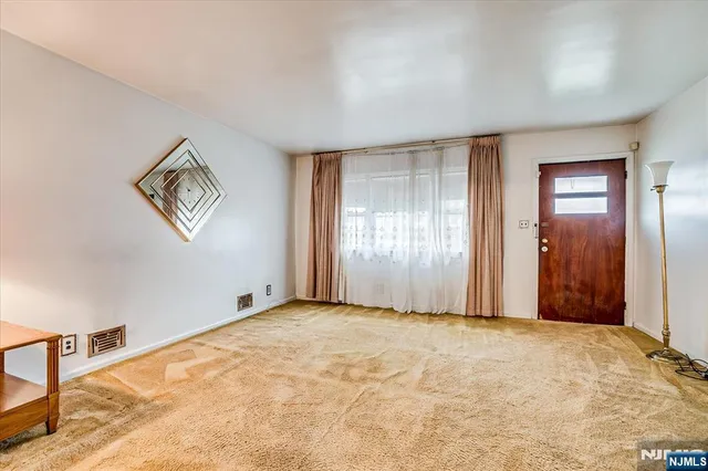 a spacious bathroom with a double vanity sink and a mirror
