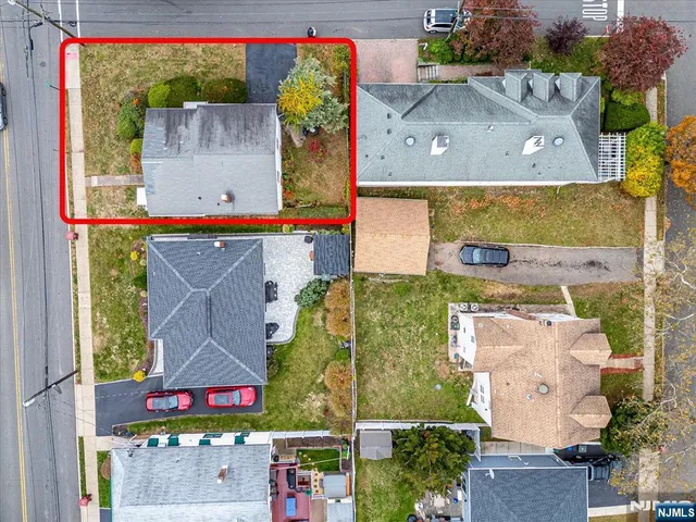 an aerial view of houses with outdoor space