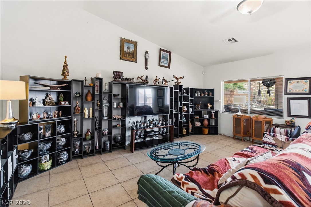 2516 Morrow Ridge Place Laughlin, NV 89029 - Photo 11 of 93 Living room featuring light tile patterned flooring and lofted ceiling