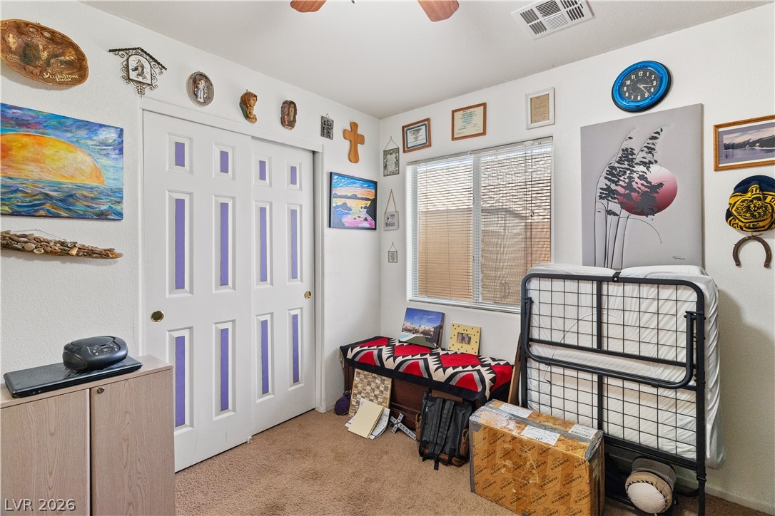 2516 Morrow Ridge Place Laughlin, NV 89029 - Photo 32 of 93 Secondary Bedroom with light carpet, a closet, and ceiling fan