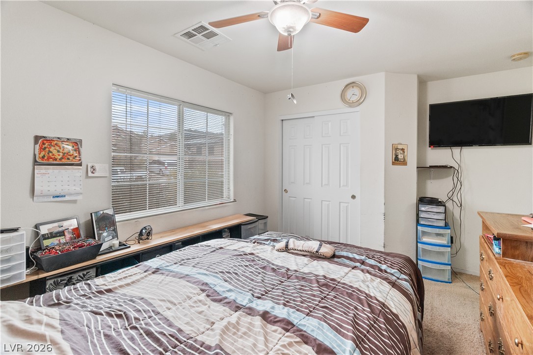 2516 Morrow Ridge Place Laughlin, NV 89029 - Photo 37 of 93 Third Bedroom with light colored carpet, a closet, and a ceiling fan